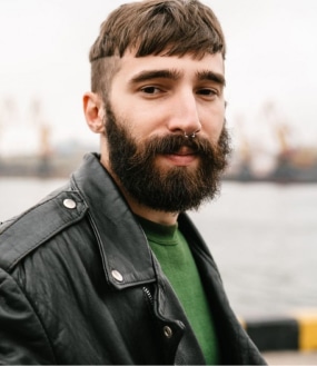 Section → 2-photo-closeup-of-bearded-young-man-looking-at-came-UDSWHUP-p4zbddzxjpy7uuzc6ui2f9fuphqy5muwbr9ada0oig.jpg